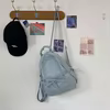 Nylon School Backpack with Bow Front and Drawstring Side Pocket Sky blue color SKU reference