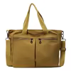 Canvas Laptop Tote with Front Pocket and Metal Buckle Yellow color SKU reference