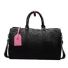 PU Travel Duffel with Decorative Cross Patterns Black · pink charm SKU overview reference