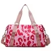 Cow-Print Nylon Gym and Weekender Duffel Pink Cow Print color SKU reference
