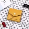 Short Leather Wallet with Sunflower Metal Detail Black color SKU reference