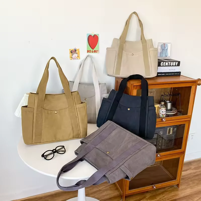 Canvas Buckle Tote with Back Zipper Pocket product reference image