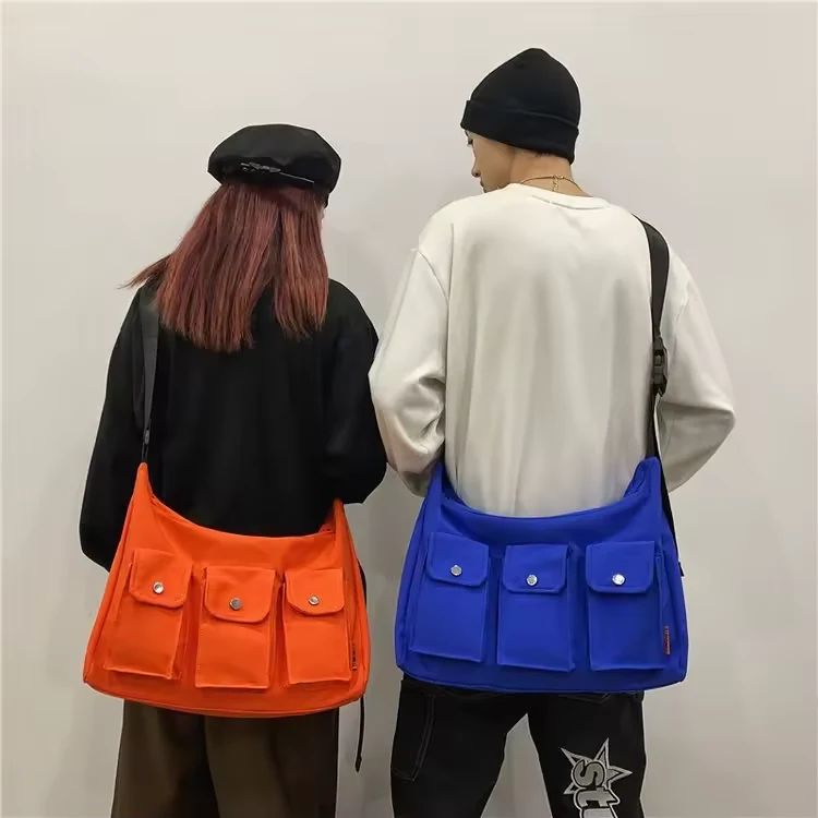 Large Canvas Sports Sling Bag with Three Buckle Pockets product reference image