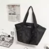 Nylon Drawstring Travel Tote with Adjustable Strap Black color SKU reference