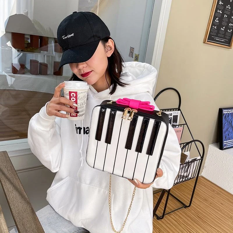Piano-Shaped PU Crossbody Bag with Double-Bow Detail product reference image