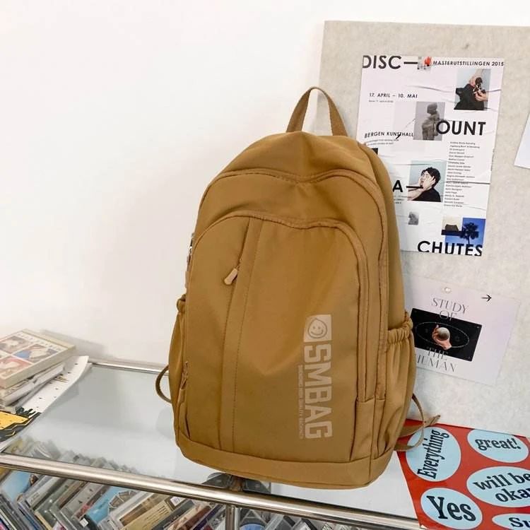 Nylon Student and Travel Backpack with Decorative Doll Charm Dark khaki color SKU reference
